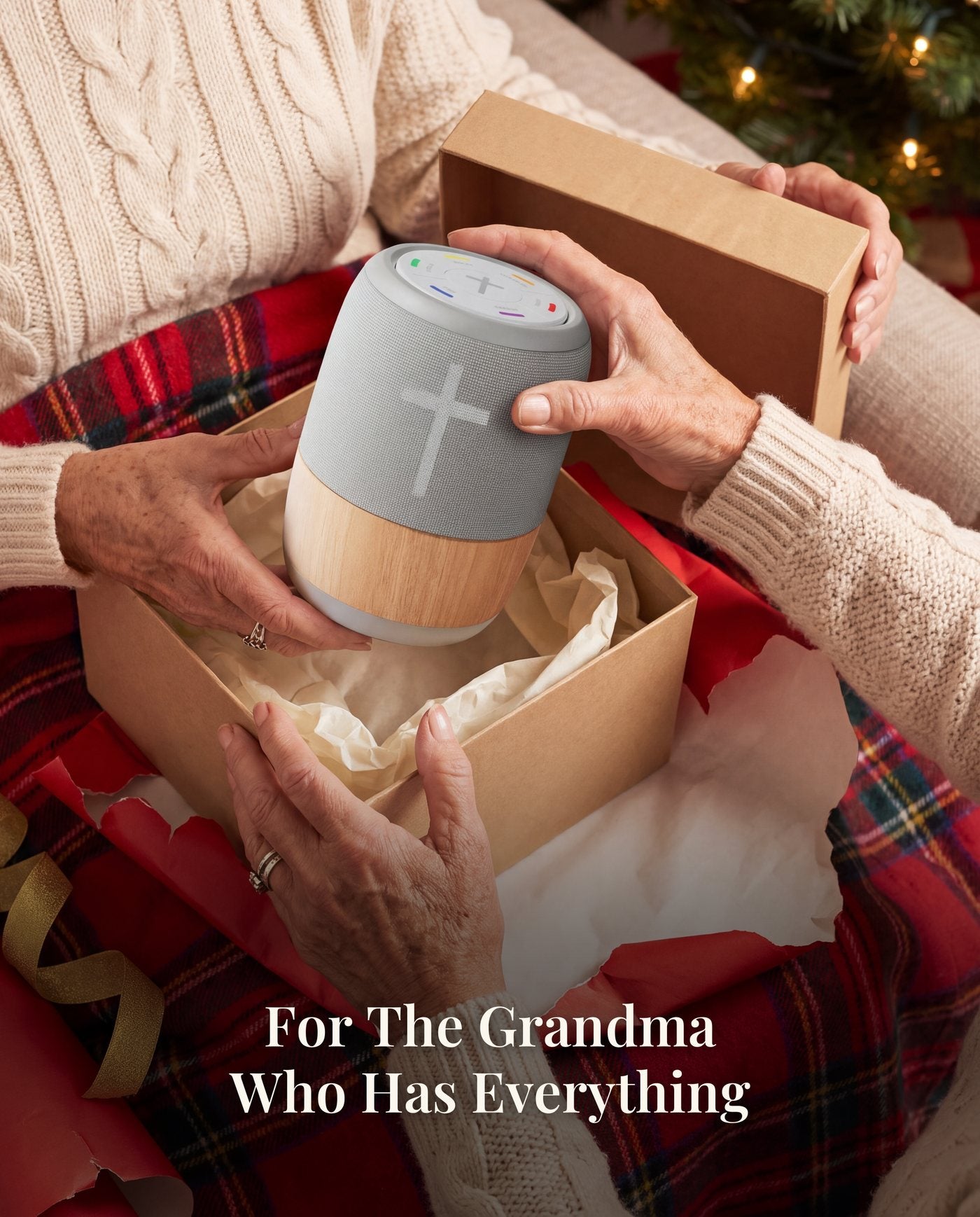 Hands lifting the player out of a kraft gift box.
