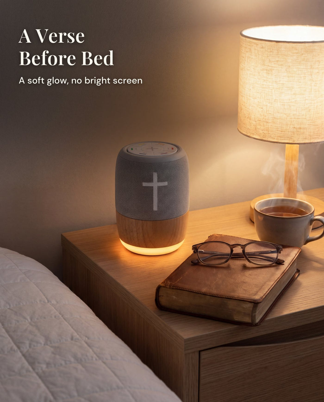 The player on a bedside table beside a lamp, a worn book, reading glasses and a cup of tea.